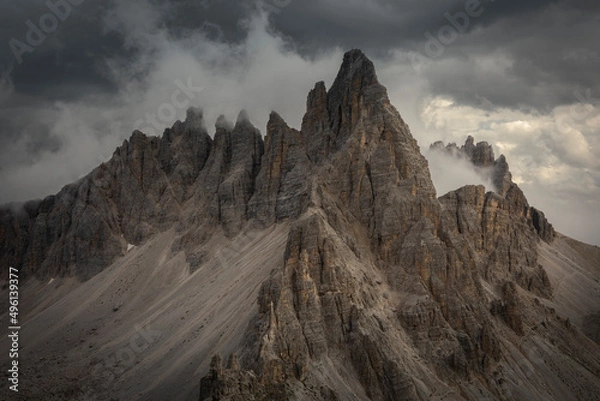 Fototapeta Paternkofel mountains in the Dolomite Alps in South Tyrol during summer with dark clouds in sky, Italy.