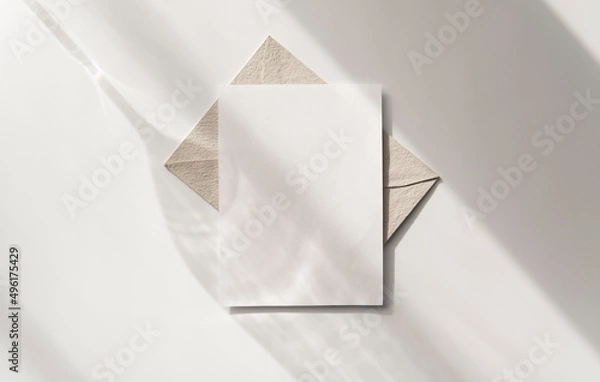 Obraz Mockup blank greeting card. Composition with shadows from a glass goblet on white background. 