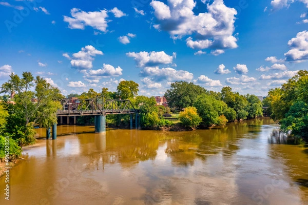 Obraz Brown water, trees and clouds River bridge