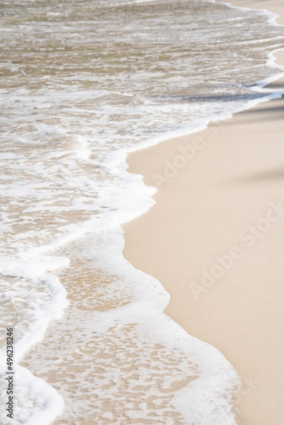 Obraz White sand waves texture lapping across untouched Shore.