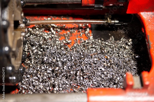 Fototapeta A lot of metal shavings close-up, after working on a milling machine or CNC machine. Texture metal shavings macro