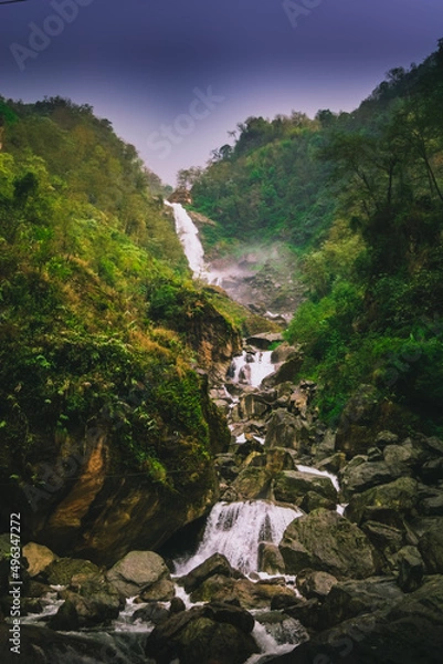 Fototapeta waterfall in the mountains in forest.