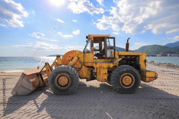 Fototapeta Heavy bulldozer working at the construction site
