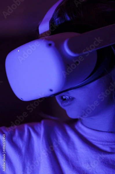 Fototapeta A child using VR headset close-up