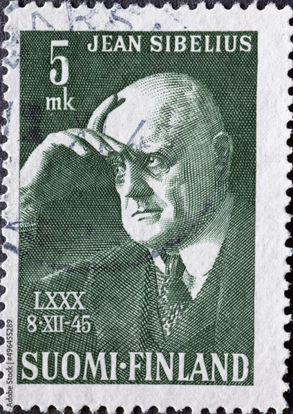 Fototapeta Finland - circa 1945: a postage stamp from Finland, showing a portrait of the composer Jean Sibelius, 80th Birthday