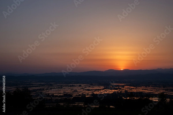 Obraz 高台から見た日の沈む田園地帯