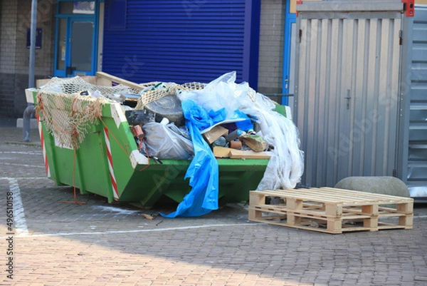 Obraz Loaded garbage dumpster