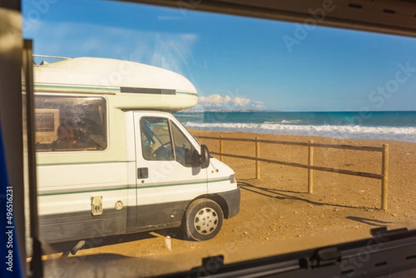 Obraz View from caravan inside on camper on beach