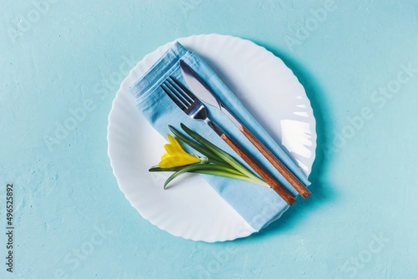 Fototapeta Spring table place setting with yellow flower