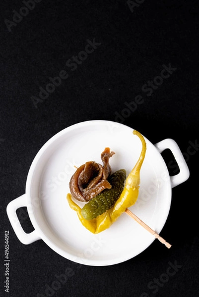 Fototapeta Typical appetiser in Basque country  "gilda" made of spicy pepper, pickled cucumber and anchovy.
