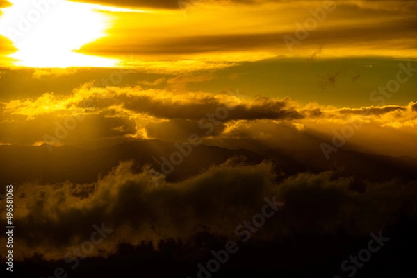 Fototapeta Intense sun light through clouds