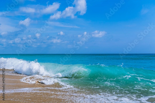 Fototapeta An ocean wave runs up to the beach and wraps itself in a pipe colliding with the previous wave flowing down from the sand. Atlantic Ocean, Florida