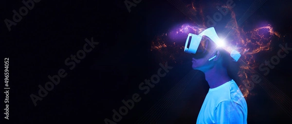 Fototapeta Man is using virtual reality headset. Elements of this image furnished by NASA.
