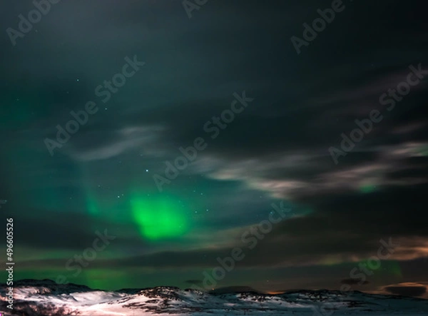 Fototapeta Landscape. The Northern lights in the sky beyond the Arctic Circle.