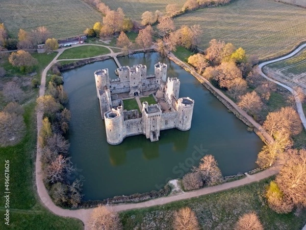 Fototapeta Aerial drone view of Bodiam Castle, 14th-century medieval fortress with moat and soaring towers in Robertsbridge, East Sussex, England.