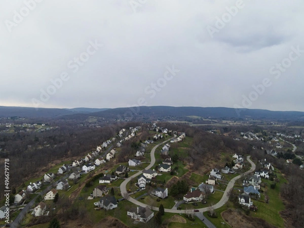 Obraz Cloudy overcast over unknown town 