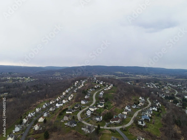 Obraz Cloudy overcast over unknown town 