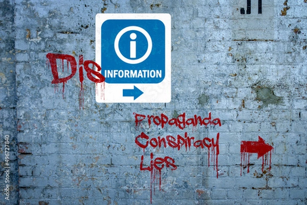 Obraz Disinformation graffiti on information sign, propaganda, conspiracy, lies spray painted on wall, misinformation, fake news concept.