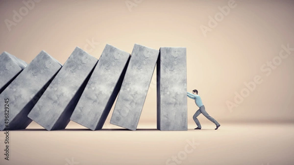 Fototapeta Man holds falling concrete cubes.