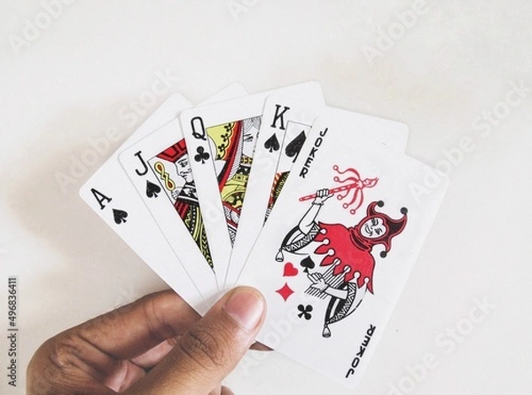Obraz Playing cards held in hand