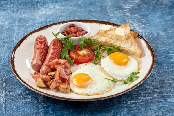 Obraz traditional breakfast with egg and sausages
