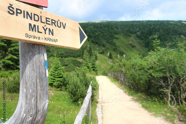 Obraz Sign Spindleruv Mlyn in Giant Mountains (Krkonose) with the tourist path in the background. Czech Republic, Bohemian Region.