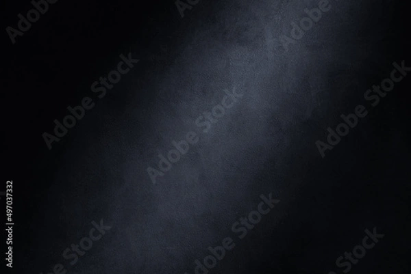 Fototapeta Dark photography backdrop. Concrete wall texture with lighting effect background.