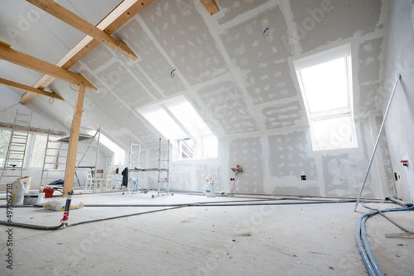 Fototapeta Attic finishing construction site in the phase drywall spackling and plastering before screeding