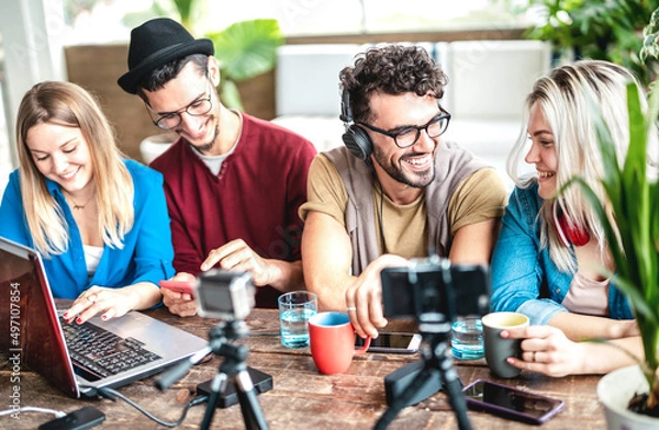 Obraz Young happy students sharing content on streaming platform with digital web cam - Modern life style concept with millenial guys and girls having fun vlogging live feeds on social media - Vivid filter