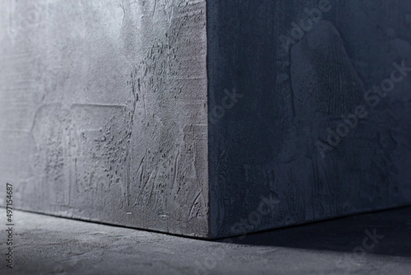 Fototapeta Concrete cube on abstract cement background texture. Wall corner of house