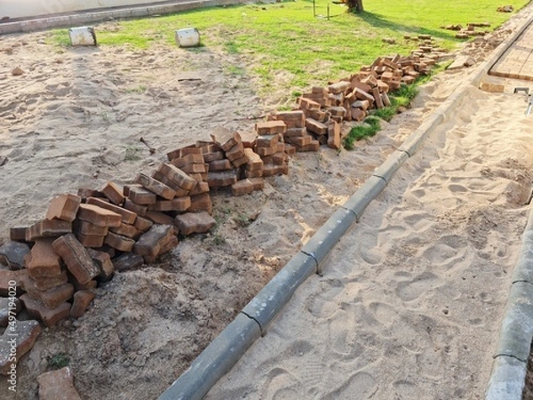 Fototapeta Pavement construction of walkway in the backyard