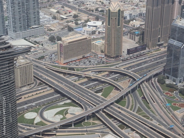 Obraz Dubai, UAE- March 31 2022: Interconnected highway interchange in Dubai allows four wheelers and trucks to change lanes and directions smoothly by reducing traffic and road accidents.