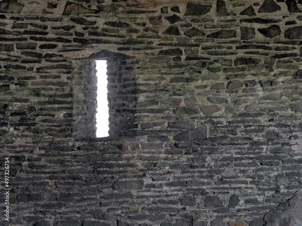 Obraz Arrow slit window in old stonebuilding.