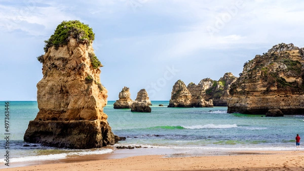 Fototapeta View of Praia de Dona Ana beach with cliffs and sand in Lagos, Algarve, Portugal