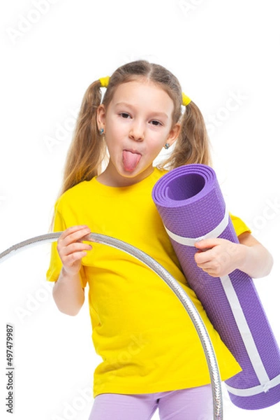 Fototapeta Little cute girl with hula hoop and gym mat. Isolated on white background.
