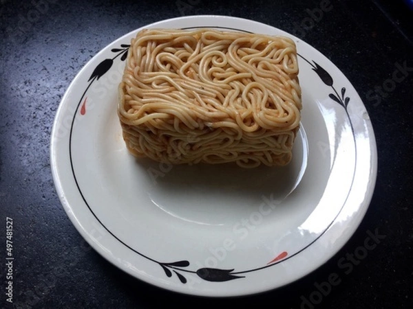 Obraz Conceptual spaghetti with tomato sauce served in box format.