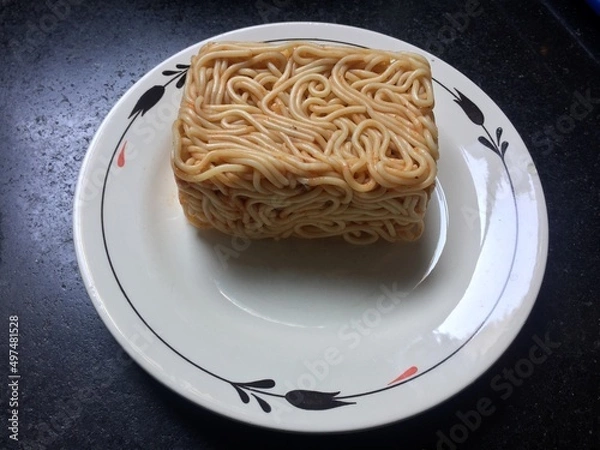 Obraz Conceptual spaghetti with tomato sauce served in box format.