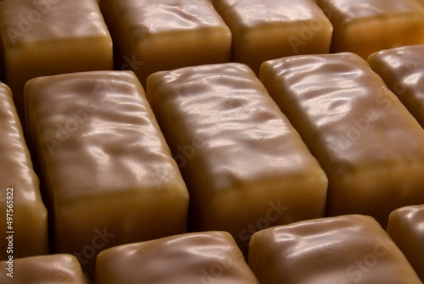 Fototapeta Soft marshmallow covered with carmel chocolate. Original name literally mean "bird's milk" (in Polish: ptasie mleczko). 
