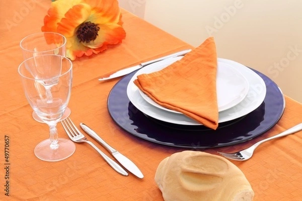 Obraz Table setting on orange table cloth
