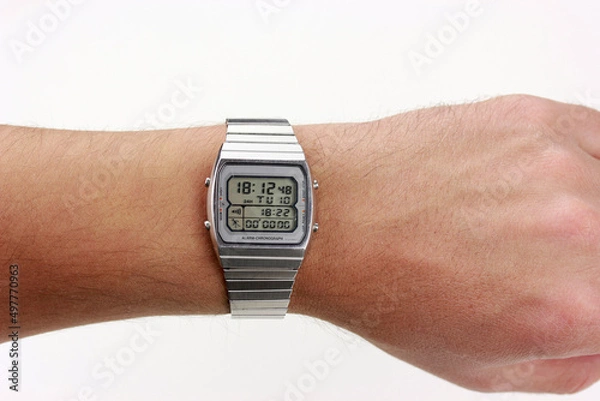 Obraz digital watch silver vintage retro wristwatch 70s 80s isolated alarm multifunctional chronograph scratched steel used made in japan rare worn
on watch stand Armbanduhr chronograph side view closeup