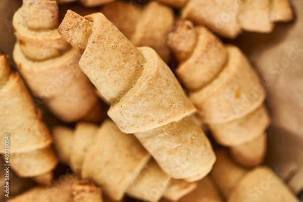 Obraz Russian slavic traditional pastry called roguelikes. Cakes bagels. Crispy croissants. Food on grey background, Closeup view