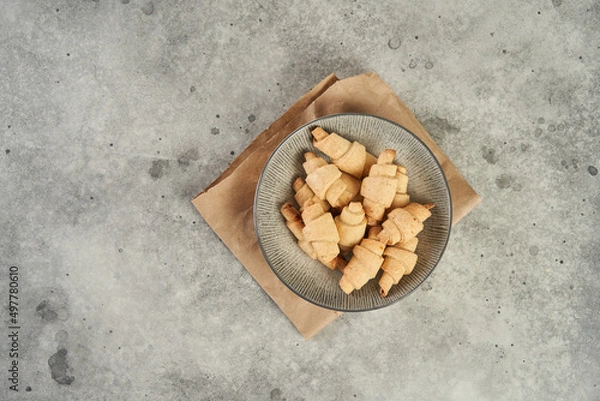 Obraz Russian slavic traditional pastry called roguelikes. Cakes bagels. Crispy croissants. Food on grey background, Copy space