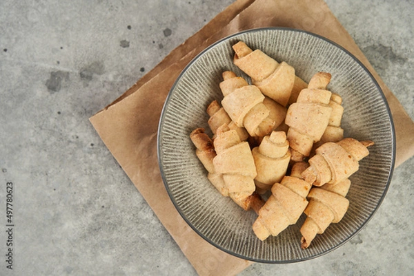 Obraz Russian slavic traditional pastry called roguelikes. Cakes bagels. Crispy croissants. Food on grey background, Copy space