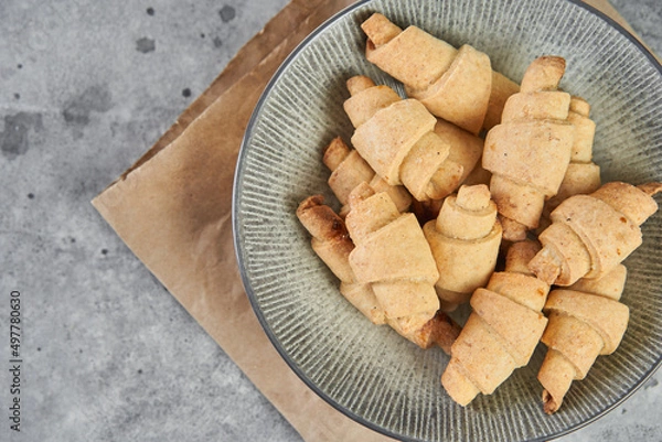 Obraz Russian slavic traditional pastry called roguelikes. Cakes bagels. Crispy croissants. Food on grey background, Copy space