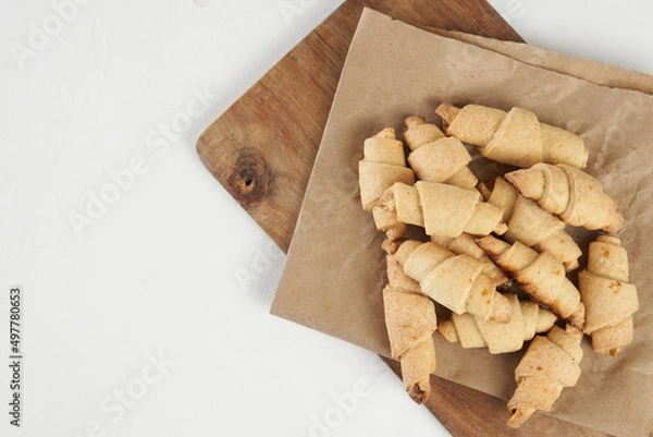 Obraz Russian slavic traditional pastry called roguelikes. Cakes bagels. Crispy croissants. Food on white background, Copy space