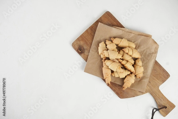 Obraz Russian slavic traditional pastry called roguelikes. Cakes bagels. Crispy croissants. Food on white background, Copy space