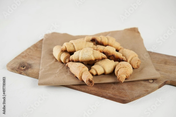 Obraz Russian slavic traditional pastry called roguelikes. Cakes bagels. Crispy croissants. Food on white background, Copy space