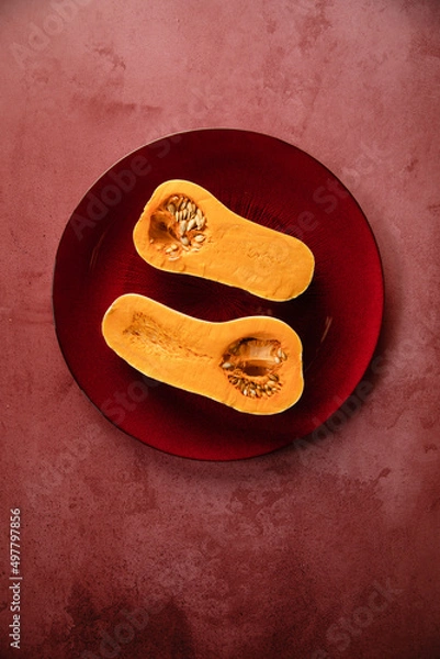 Fototapeta  minimalistic still life raw pumpkin in a stone background
