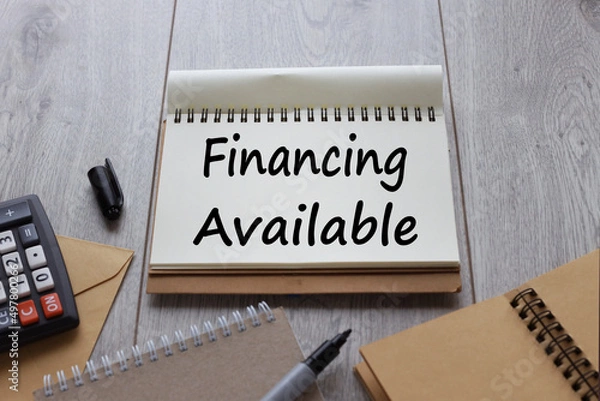 Fototapeta Financing Available text on notepad paper near many notepads