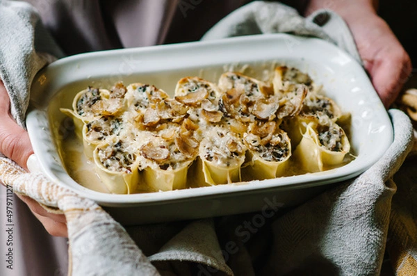 Obraz Cannelloni with mushroom stew and chestnuts. Author's Corsican cuisine. Cannelloni in a baking dish